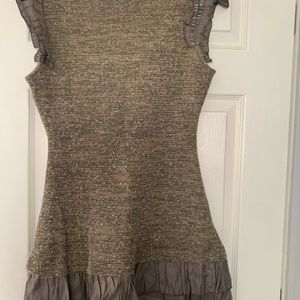 Sleeveless gorgeous sweater with beautiful detail.